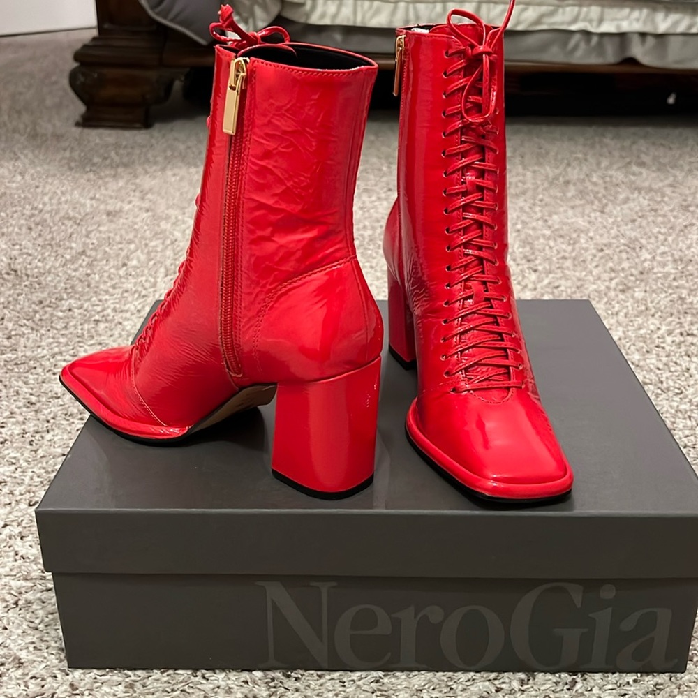 Red dress boot in a block 3’ heel leather wet patent. Brand new. Size 6.